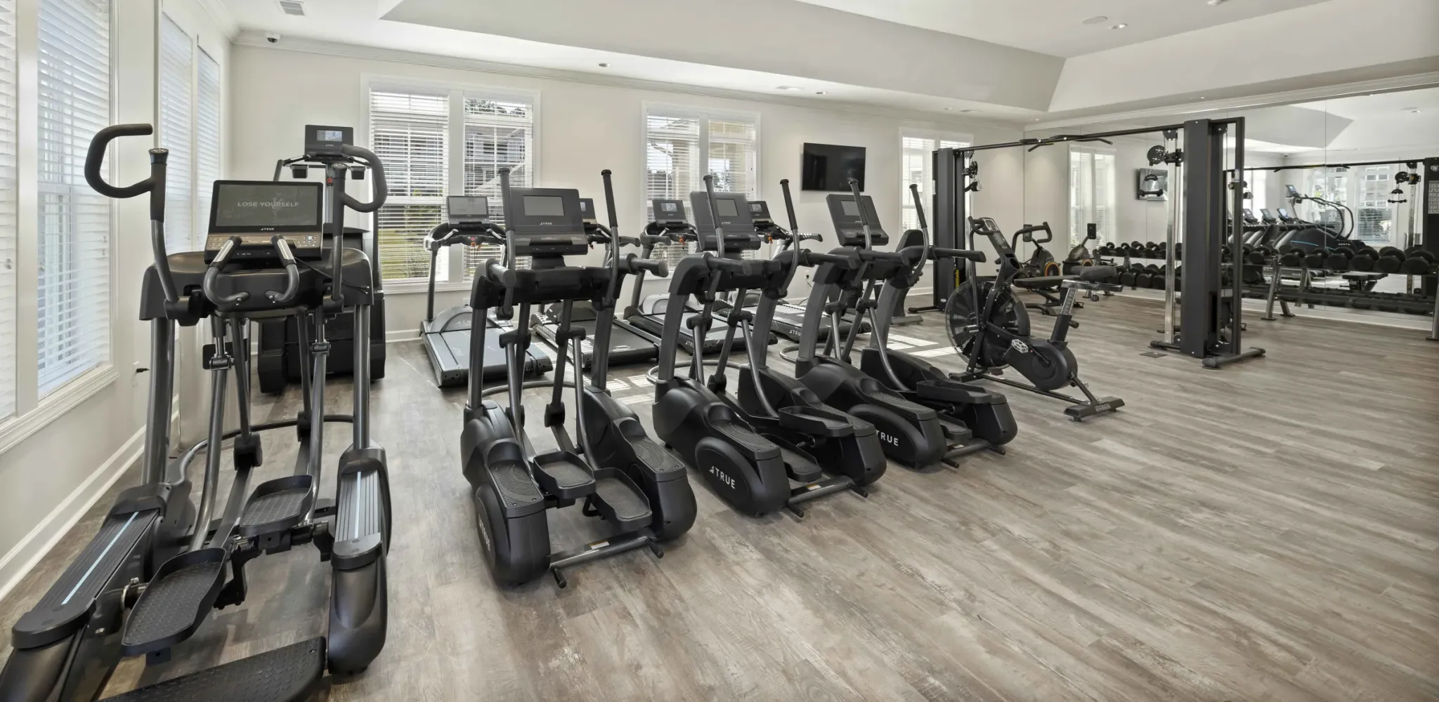 Hudson at Carolina ColoursA cozy bedroom featuring a ceiling fan above a neatly made bed