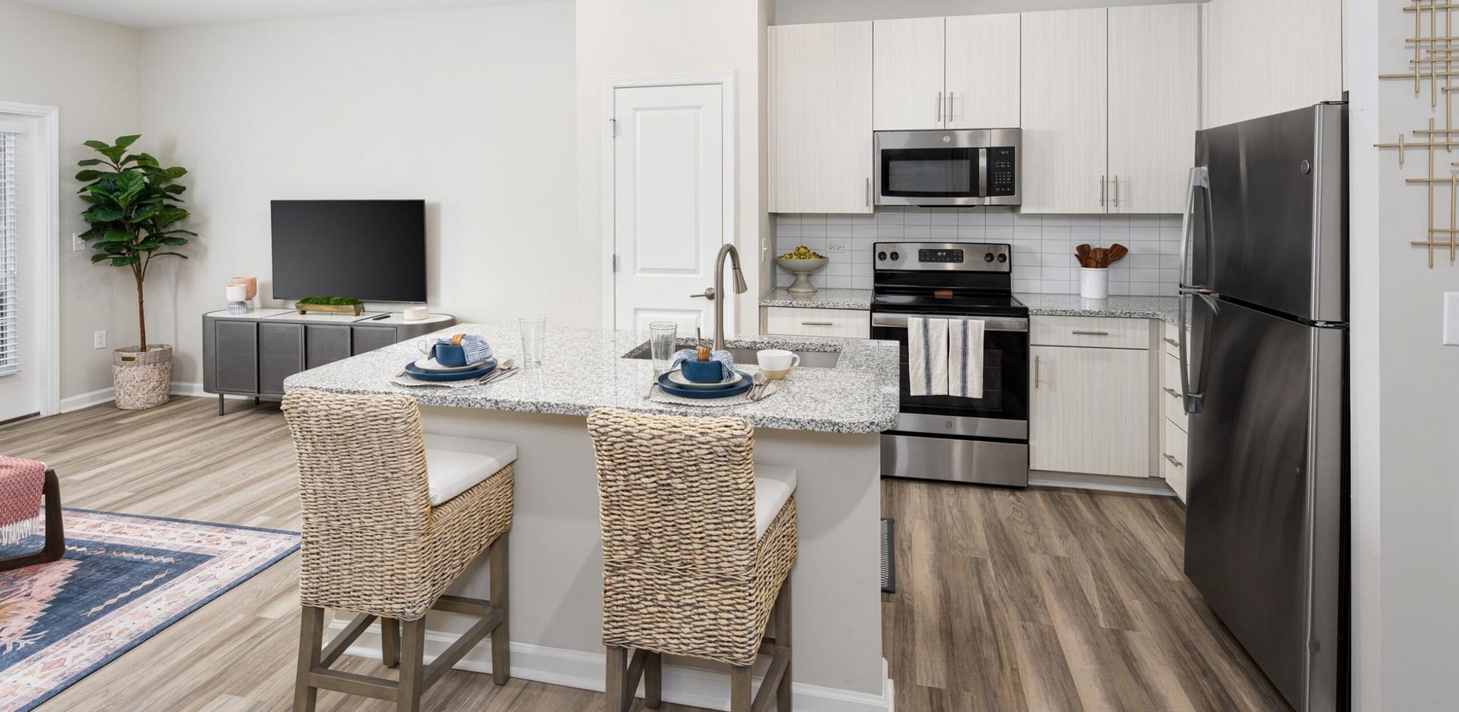 Hudson at Carolina ColoursA cozy bedroom featuring a ceiling fan above a neatly made bed