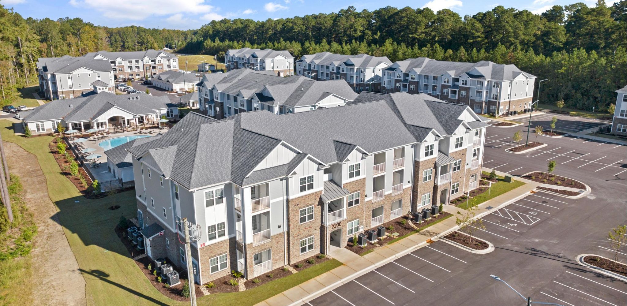 Hudson at Carolina ColoursResidential complex featuring modern architecture and landscaped grounds.